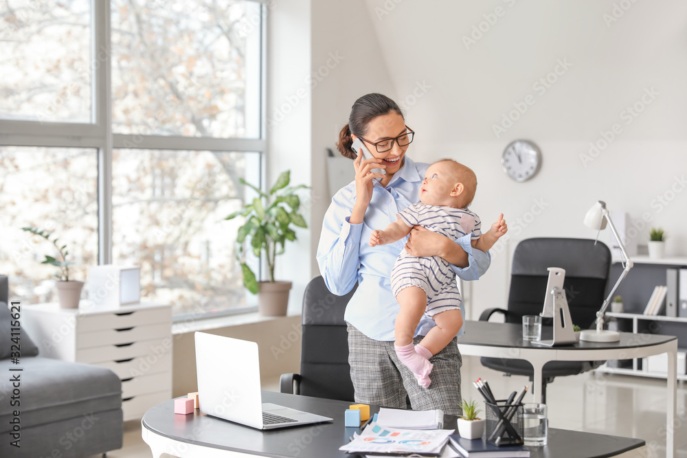 Canvas Prints Working mother with her baby in office