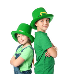 Funny little children on white background. St. Patrick's Day celebration