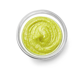 Bowl with tasty sauce on white background