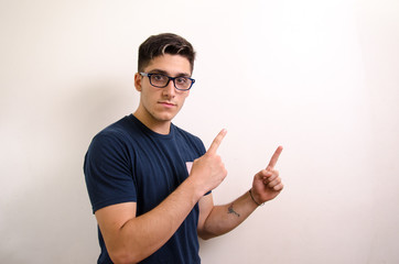 Young man pointing with his fingers