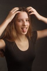Obraz premium Studio portrait of a girl in a black t-shirt