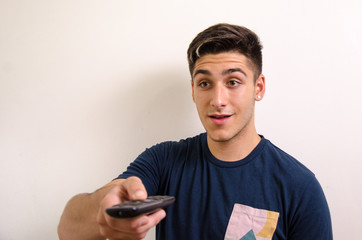 Young man with remote control