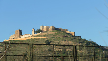 Castle on hill  in Andalusian sunshine