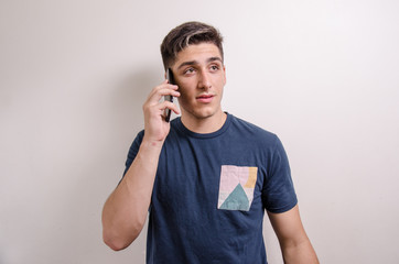 Young man with his cell phone on a call