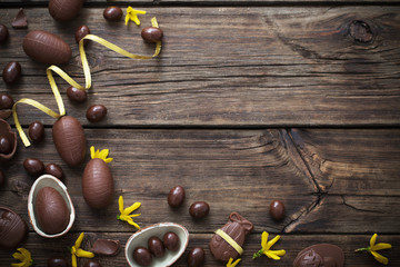 chocolate eggs on dark wooden background