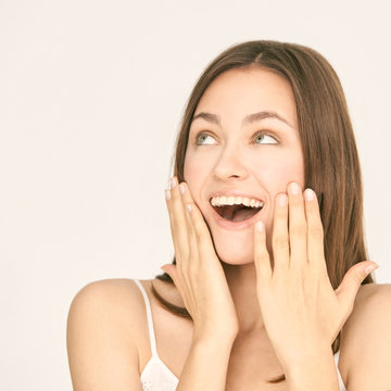 Incredible Beauty Girl Studio Portrait. Gorgeous Happy Energy Female Model. Oops Or Winner Emotion. Wow Exited Woman.