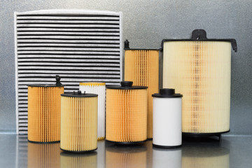 Auto filters close-up on a steel background. New car parts.