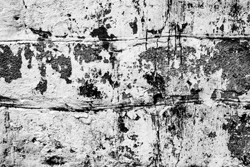 Texture of a concrete wall with cracks and scratches which can be used as a background