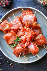raw meat skewers pork marinade (healthy food) menu concept background. top view. copy spaces