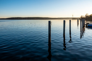 lake with telecommunication tower in Winter