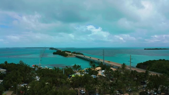 Aerial drone 4K UHD footage of the famous Highway One leading from Miami Beach all the way down to Key West in Florida. The turquoise Atlantic Ocean is  surrounding the hundreds of coral reef islands.