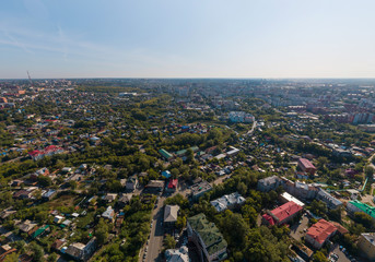 Aerial view of Tomsk city with a lot of trees. Summer, sunny day