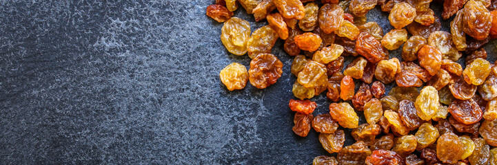 raisins, delicious dried grapes (fresh fruit vitamins) menu concept background. top view. copy space