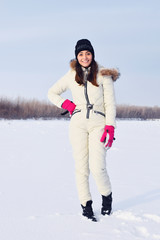 Fototapeta na wymiar smiling young woman in the snow