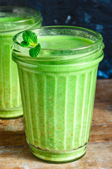 green smoothie cocktail antioxidant diet (organic fruit vitamins, vegetarian drink) menu concept background. top view. copy space