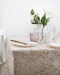 table with holiday decor and dishes, close-up