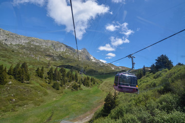 Gondola going up to Bettmerhorn near Aletsch glacier on a sunny day