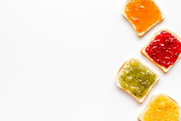 Toast with jam. Colorful set on white background top-down frame copy space