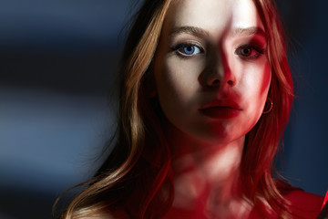Sensual beautiful young Woman in red light