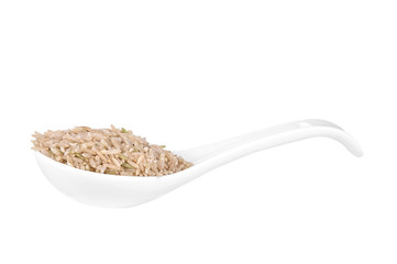 Coarse rice in spoon a white background