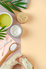 Cream and olive oil and body care products. Image with free space for text.