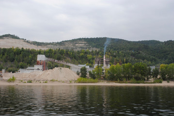 Fototapeta na wymiar mining of crushed mountain on the shore