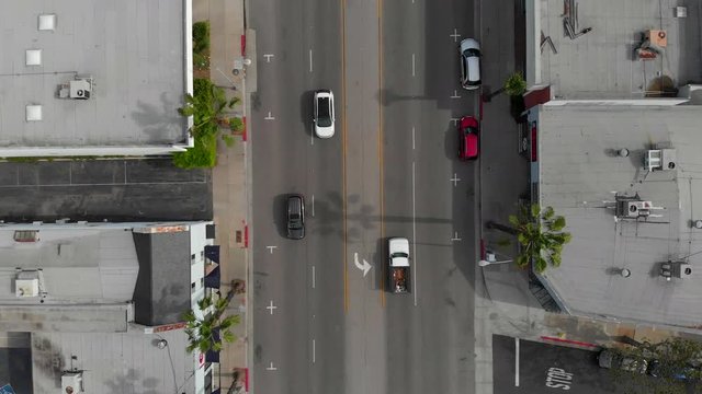 Drone above Los Angeles road, horizon reveal.