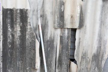 Broken asbestos wall in Ho Chi Minh City,  Vietnam