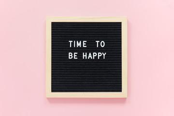 Time to be happy. Motivational quote on letterboard on pink background. Top view Flat lay Concept inspirational quote of the day