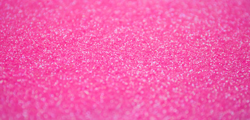 Blur pink sparkle background. Defocused glitter texture