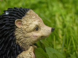 garden figure of a hedgehog in the grass, Russia