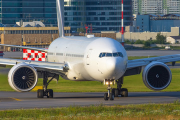 Large passenger aircraft taxiing after landing on runway