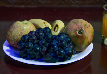 A shot of plate of fruits and refreshment