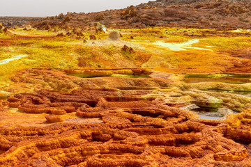 Colorful incredible abstract apocalyptic landscape like moonscape of Dallol Lake in Crater of Dallol Volcano, Danakil Depression, Ethiopia