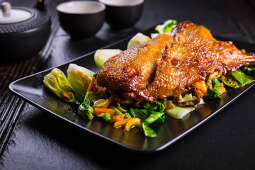 Peking duck breast with pak choi and vegetables