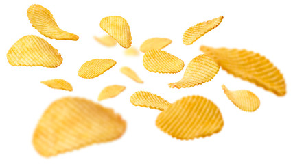 Fluted potato chips levitate on a white background