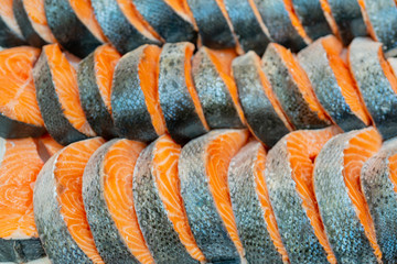 Fresh salmon steaks. Seafood is sold at store. Fresh fish at supermarket window.