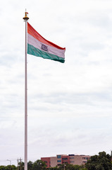 Bright colored Indian flag waving proudly shot from a low angle. Patriotism concept