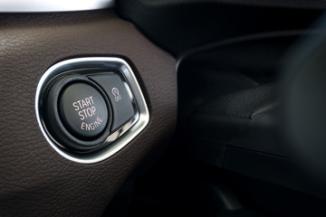 Close up of Start Stop button , Keyless entry System in modern car background.