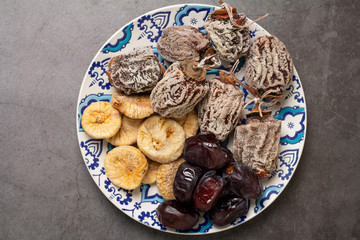 plate with different dried fruits top view