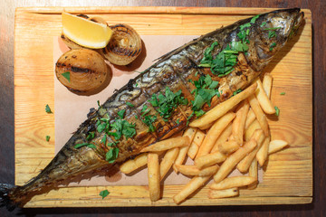 Delicious, fresh, baked mackerel in josper. Seafood. Healthy food. Close-up.
