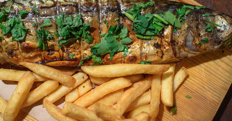 Delicious, fresh, baked mackerel in josper. Seafood. Healthy food. Close-up.