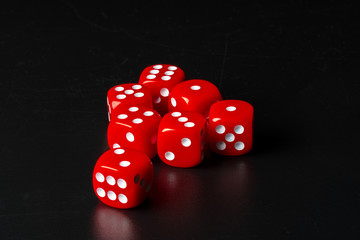 Group of dice close up on dark black background