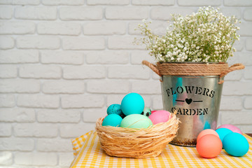 Fresh spring flowers with painted eggs for Easter celebration