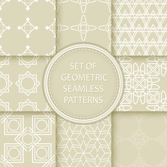 Compilation of seamless patterns. White abstract and geometric prints on olive green background