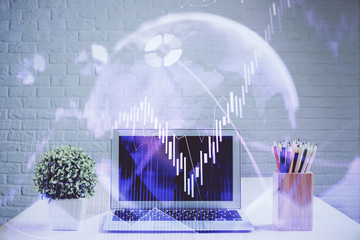 Double exposure of forex chart and work space with computer. Concept of international online trading.