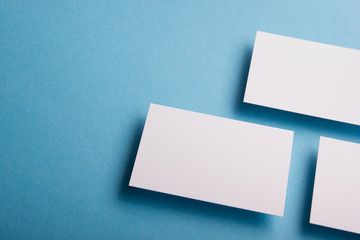 Business card blank on wooden background. Corporate Stationery, Branding Mock-up. Creative designer desk. Flat lay. Copy space for text