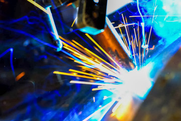 Pipe welding. Welding works. Sparks of welding.