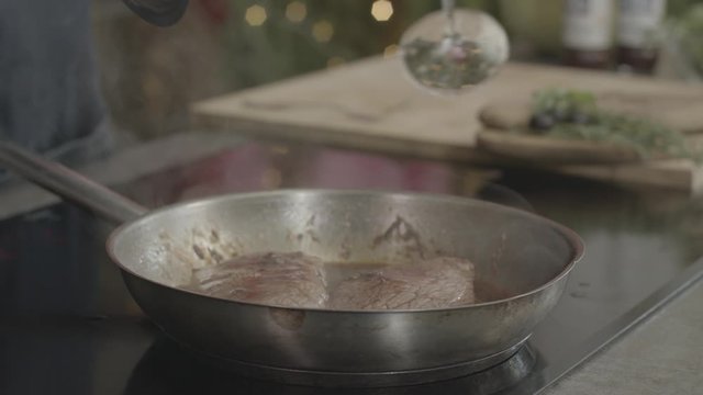 cooking meat in a pan 