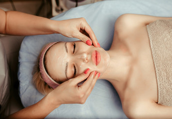 face massage on woman in the spa salon